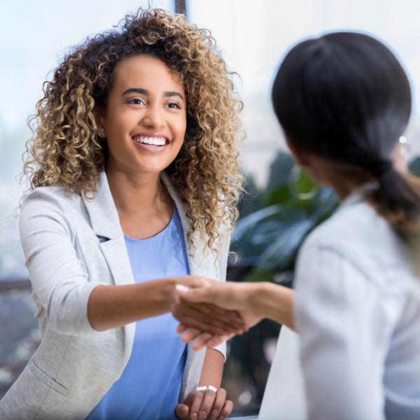 woman shaking hands with doctor