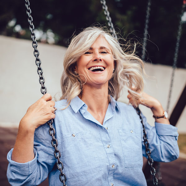 middle aged woman on swing