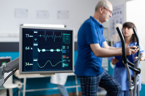 Close Up of Heart Rate Monitor Measuring Heartbeat of an Old Patient.