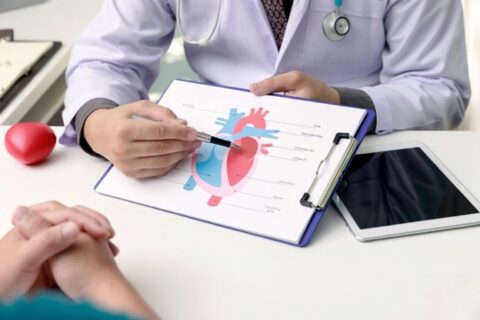 A doctor debunks common myths about heart disease to their patient during an exam