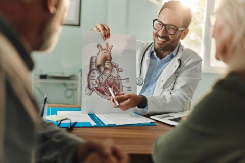 Doctor discussing heart anatomy to explain cardiovascular health risks in Sugar Land, TX